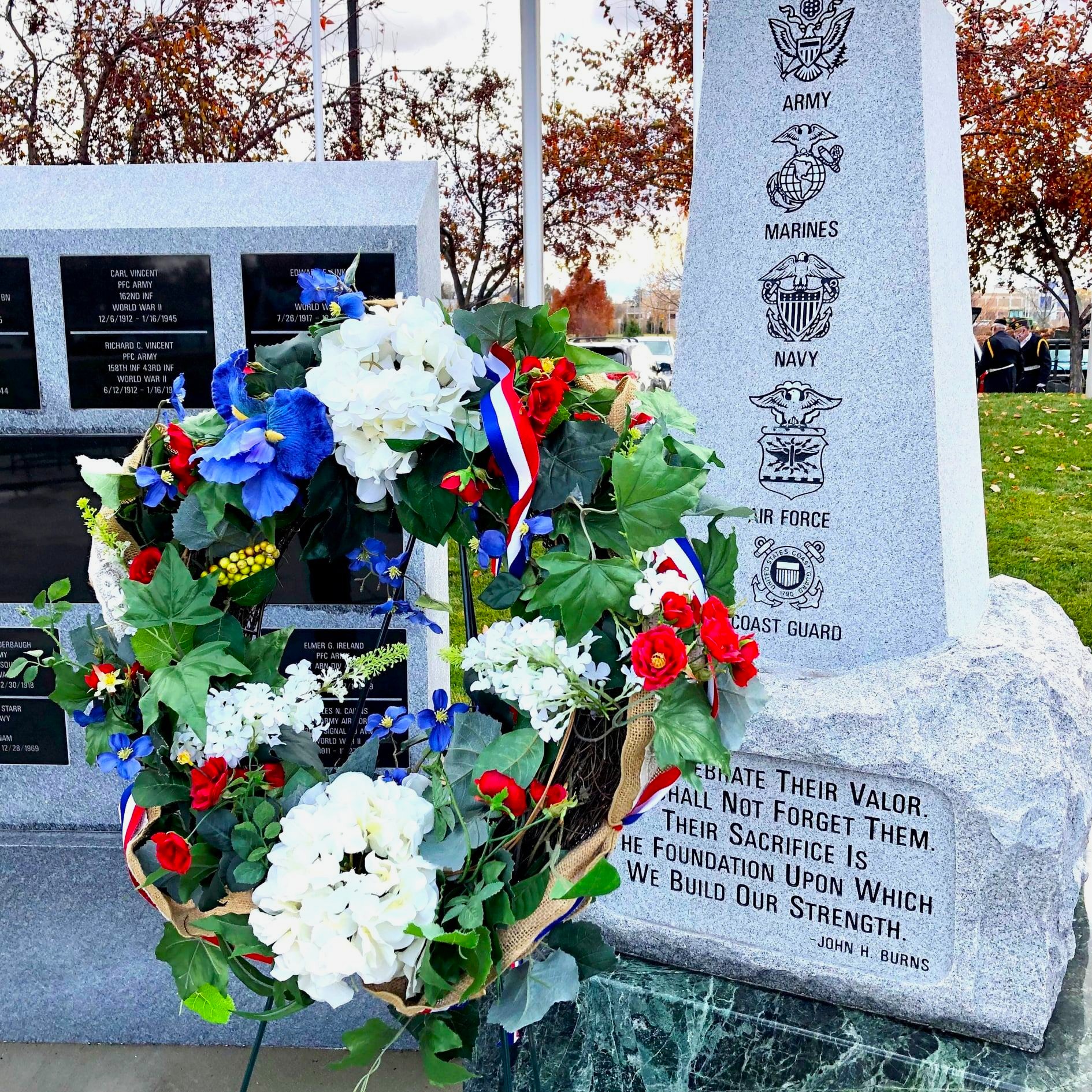 Rock of Honor with flower wreath in foreground